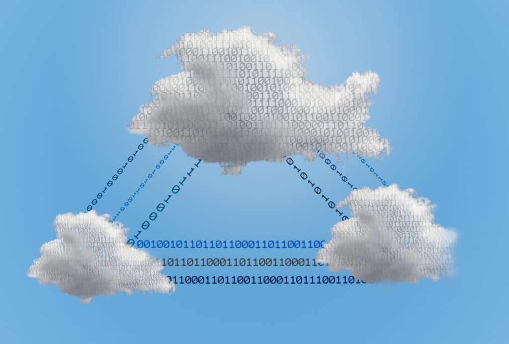 Three fluffy clouds are connected by streams of binary code (ones and zeros) against a blue sky, symbolizing cloud computing and echoing “Long live Cloud Financial Management” in the evolving FinOps landscape.